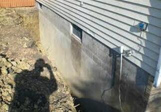 Repaired Foundation with Concrete Siding